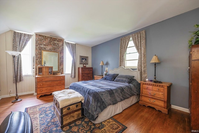 bedroom with wood finished floors and baseboards