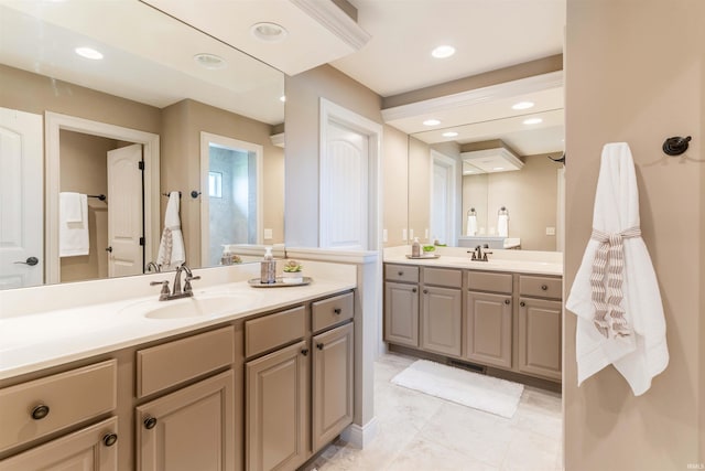 3121 Ralston Dr, Evansville, IN 47715 - bathroom featuring two vanities and recessed lighting