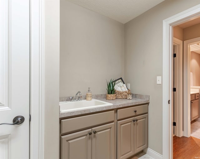 3121 Ralston Dr, Evansville, IN 47715 - bathroom with vanity and wood finished floors