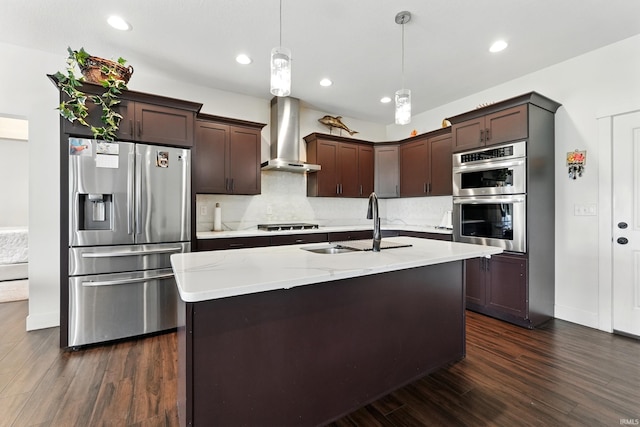 1263 E Legacy Ln, Winona Lake, IN 46590 - kitchen with stainless steel appliances, wall chimney range hood, a sink, dark brown cabinetry, and dark wood-style flooring
