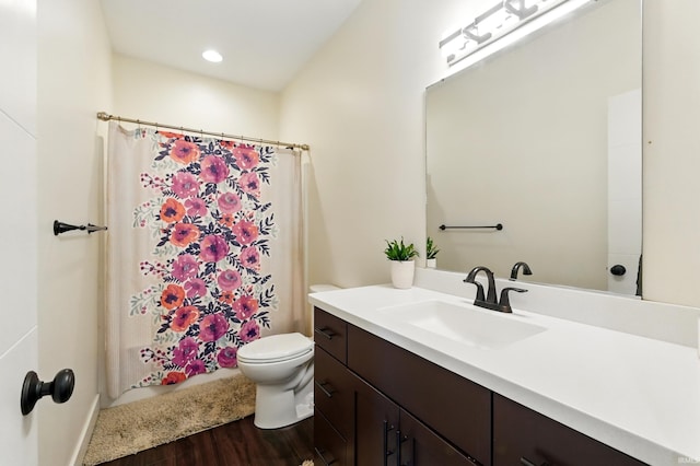 1263 E Legacy Ln, Winona Lake, IN 46590 - full bath featuring wood finished floors, toilet, vanity, a shower with curtain, and recessed lighting