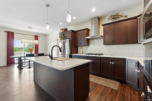 1263 E Legacy Ln, Winona Lake, IN 46590 - kitchen with wall chimney exhaust hood, appliances with stainless steel finishes, dark wood-type flooring, backsplash, and recessed lighting