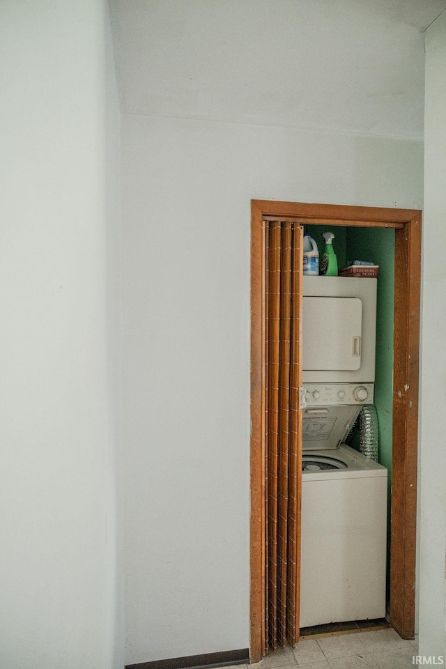 washroom with stacked washer / dryer