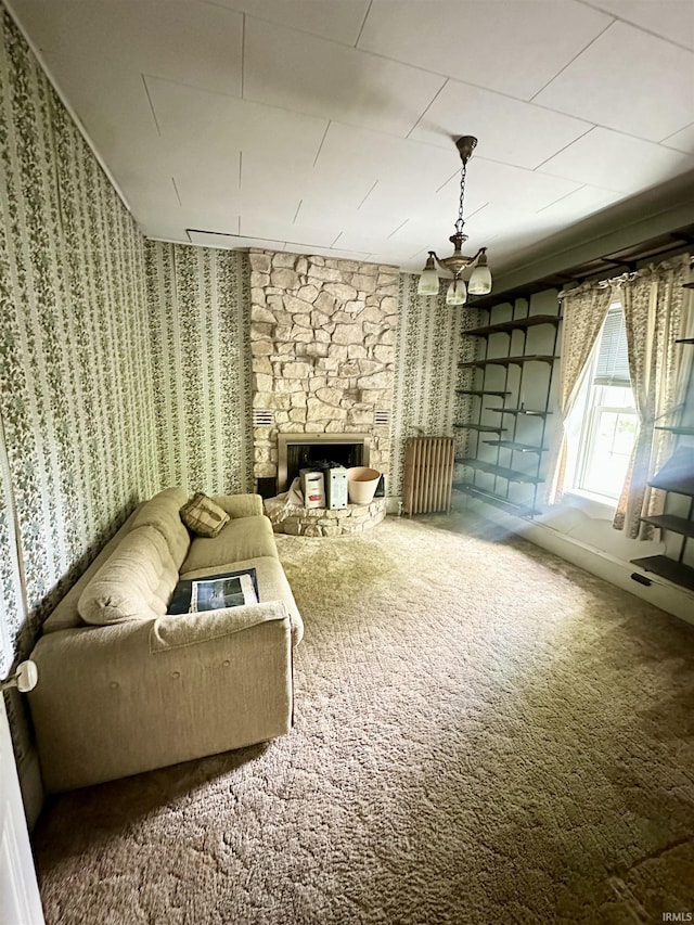 306 Wabash St, Berne, IN 46711 - unfurnished room with wallpapered walls, carpet, and a stone fireplace