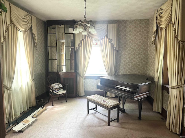 306 Wabash St, Berne, IN 46711 - living area with wallpapered walls, a chandelier, and carpet flooring