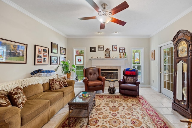 5132 Dunbar Dr, Lafayette, IN 47905 - living room with crown molding, a tiled fireplace, a ceiling fan, light tile patterned flooring, and baseboards
