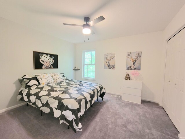 bedroom featuring carpet flooring, a closet, baseboards, and a ceiling fan