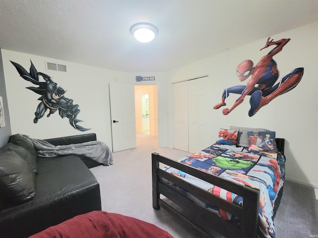 bedroom featuring carpet and a closet