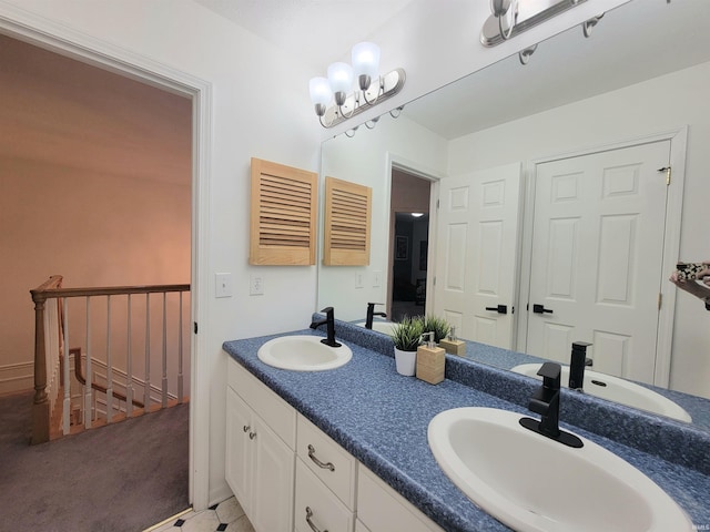 bathroom featuring double vanity and a chandelier