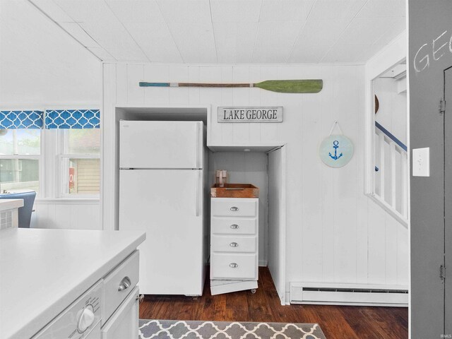 315 Lane 201bb Lake George Ln, Fremont, IN 46737 - kitchen with freestanding refrigerator, a baseboard heating unit, dark wood finished floors, white cabinets, and light countertops