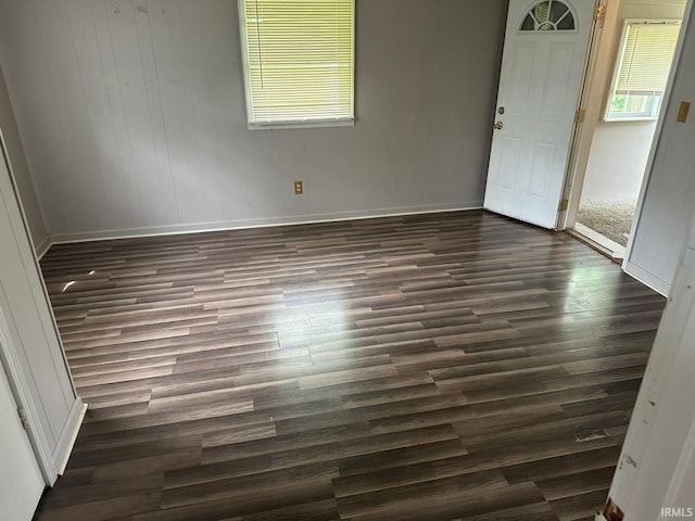 2711 S Villa Dr, Evansville, IN 47714 - unfurnished room featuring baseboards and dark wood-style floors