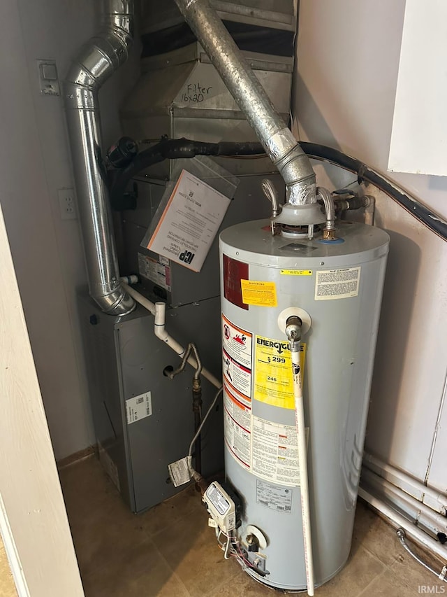 2711 S Villa Dr, Evansville, IN 47714 - utility room featuring water heater and heating unit