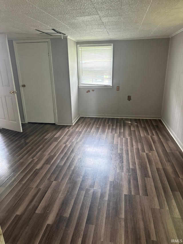 2711 S Villa Dr, Evansville, IN 47714 - unfurnished bedroom with dark wood finished floors and baseboards
