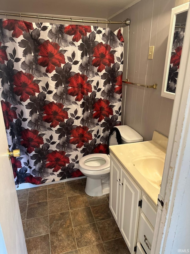2711 S Villa Dr, Evansville, IN 47714 - bathroom with toilet, vanity, stone finish flooring, and a shower with curtain
