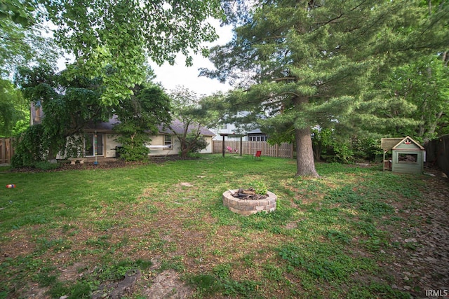view of yard with an outdoor fire pit