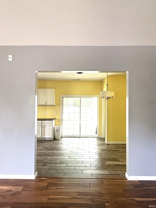 3051 Bluster Ct, West Lafayette, IN 47906 - unfurnished living room featuring dark wood-type flooring and baseboards
