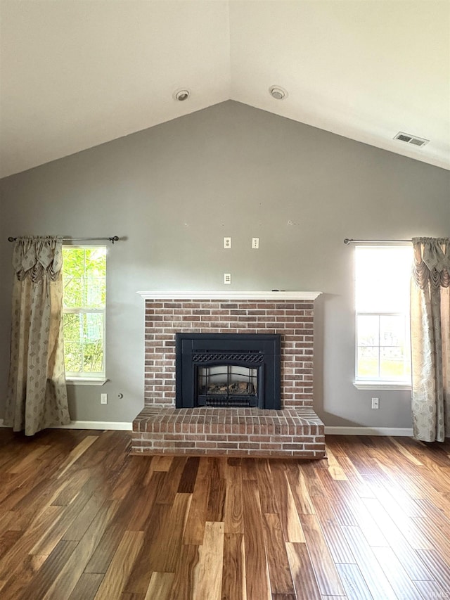 3051 Bluster Ct, West Lafayette, IN 47906 - detailed view of a brick fireplace, wood finished floors, and baseboards