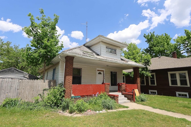 bungalow-style home featuring a porch and brick siding