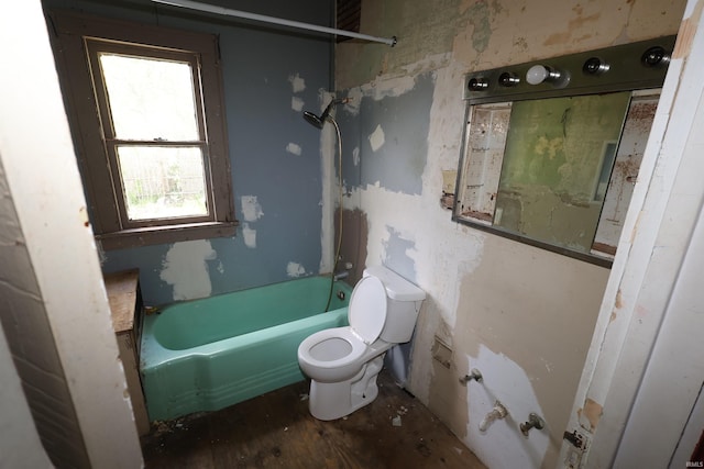 bathroom with toilet and wood finished floors