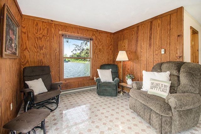living area featuring a baseboard heating unit and wooden walls