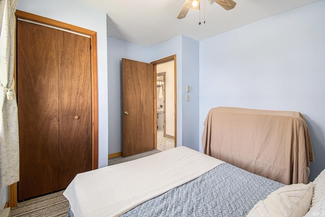 bedroom with ceiling fan and a closet
