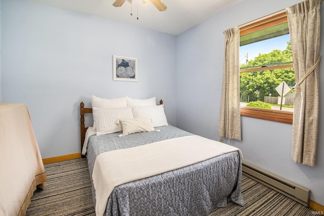 bedroom featuring baseboard heating, baseboards, and ceiling fan