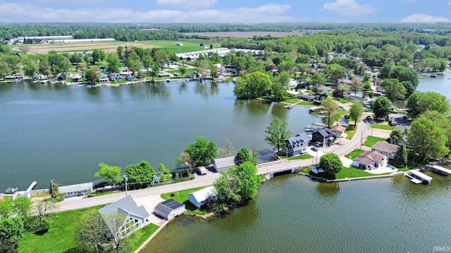 aerial perspective of suburban area featuring a nearby body of water