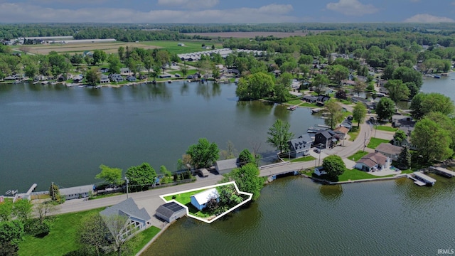 aerial perspective of suburban area featuring property parcel outlined and a large body of water