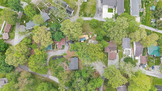 aerial view of property and surrounding area featuring nearby suburban area