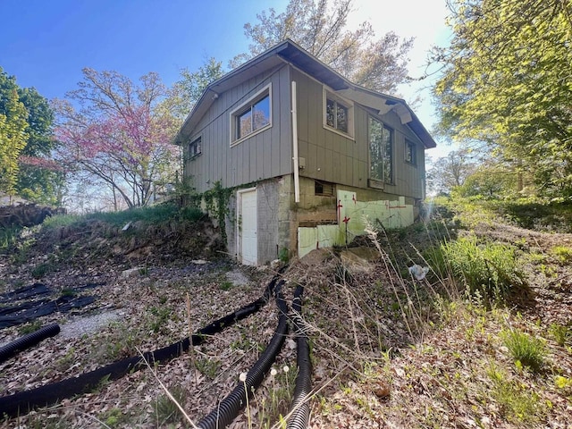 view of property exterior with board and batten siding