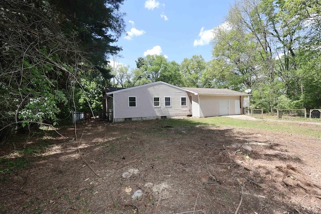 view of property exterior with fence