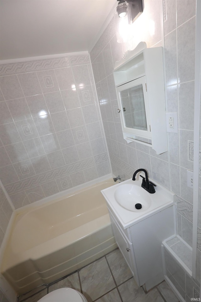 full bath with tile walls, vanity, tile patterned floors, and tasteful backsplash