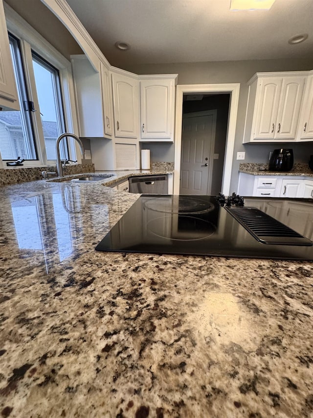 1953 S Troon Rd, Winona Lake, IN 46590 - kitchen featuring a sink, white cabinets, black electric stovetop, light stone counters, and recessed lighting