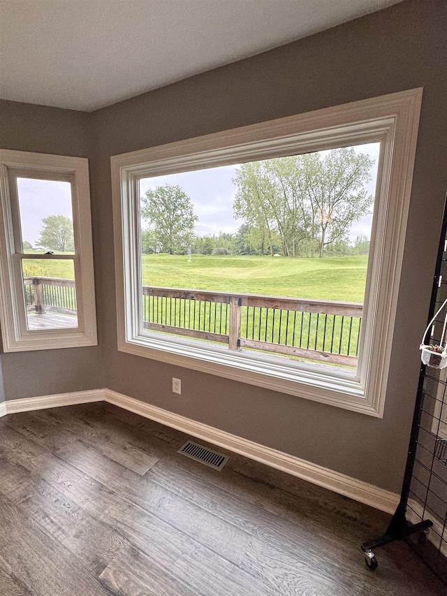 1953 S Troon Rd, Winona Lake, IN 46590 - unfurnished dining area with baseboards and dark wood-type flooring