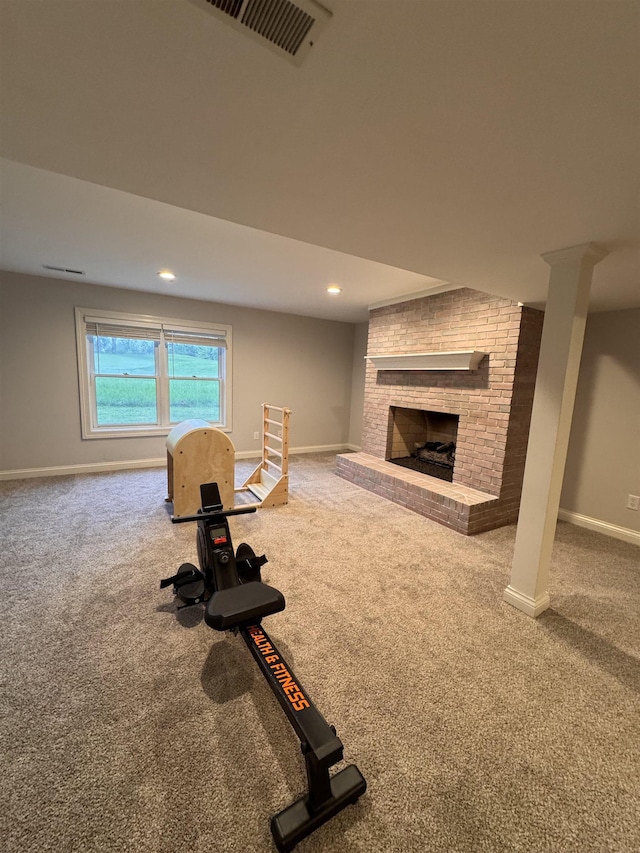 1953 S Troon Rd, Winona Lake, IN 46590 - exercise room featuring carpet flooring, baseboards, a brick fireplace, and recessed lighting