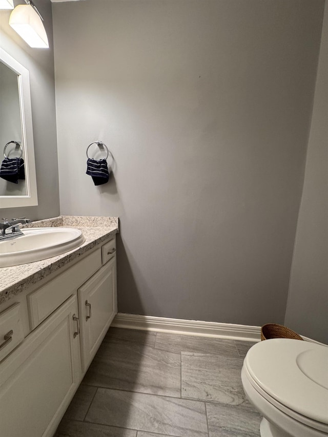 1953 S Troon Rd, Winona Lake, IN 46590 - bathroom featuring vanity, toilet, and baseboards