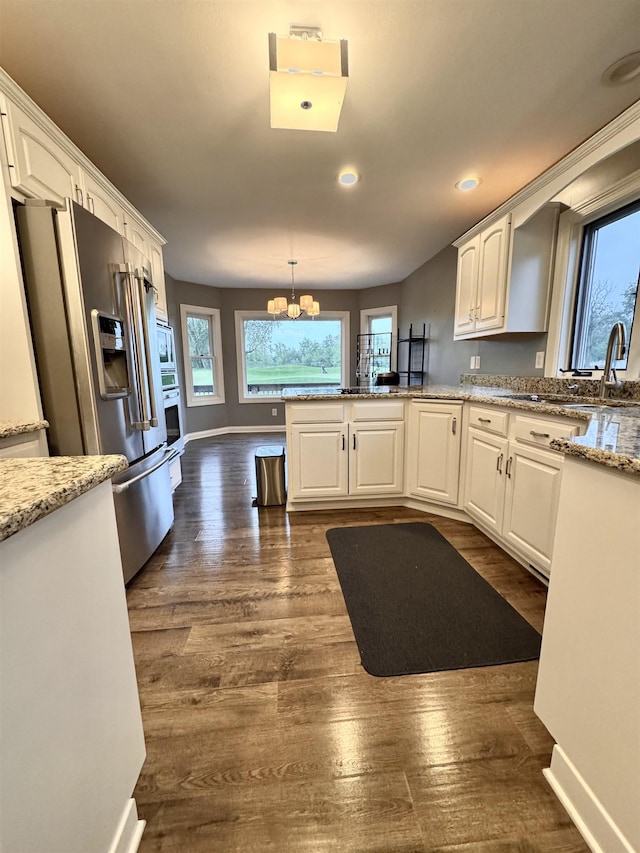 1953 S Troon Rd, Winona Lake, IN 46590 - kitchen with appliances with stainless steel finishes, healthy amount of natural light, white cabinets, and recessed lighting