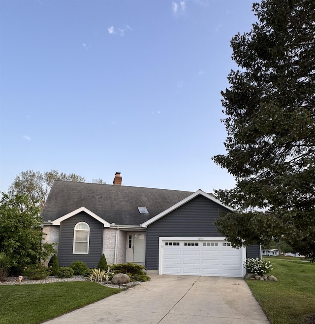 1953 S Troon Rd, Winona Lake, IN 46590 - ranch-style home featuring concrete driveway, a garage, a chimney, a front yard, and roof with shingles