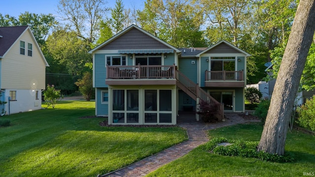 back of house featuring a wooden deck, a lawn, and stairway