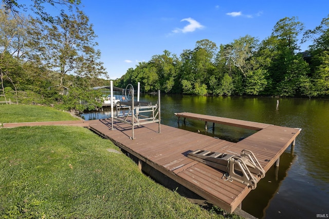 dock featuring a lawn and a water view
