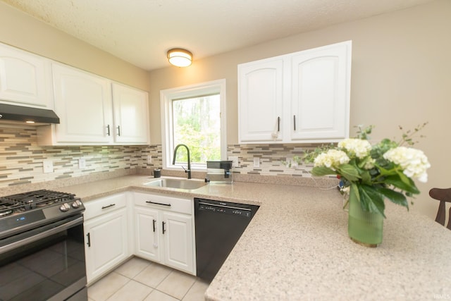 kitchen featuring stainless steel gas range oven, a sink, dishwasher, under cabinet range hood, and tasteful backsplash