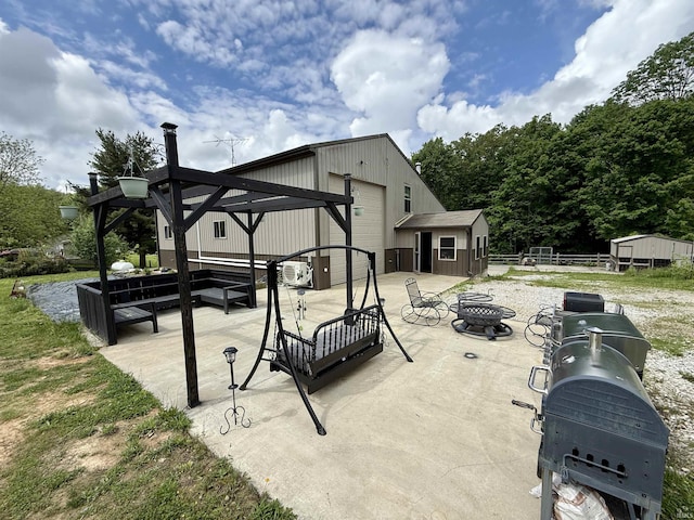 11475 Tedrow Ln, Shoals, IN 47581 - view of patio with an outdoor living space with a fire pit, an outdoor structure, and fence