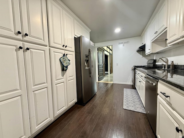 11475 Tedrow Ln, Shoals, IN 47581 - kitchen featuring appliances with stainless steel finishes, a sink, white cabinets, dark wood-type flooring, and baseboards