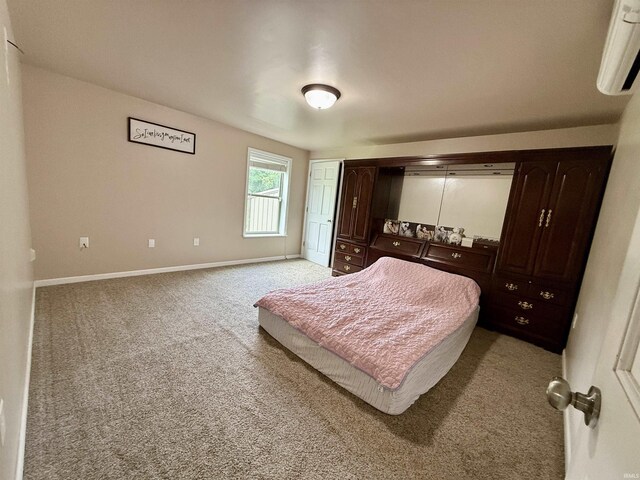 11475 Tedrow Ln, Shoals, IN 47581 - bedroom featuring light colored carpet, baseboards, an AC wall unit, and a closet