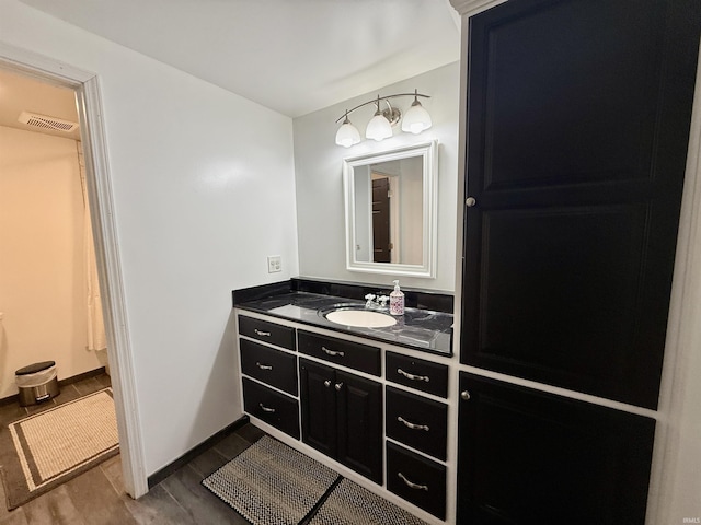 11475 Tedrow Ln, Shoals, IN 47581 - bathroom with vanity, baseboards, and wood finished floors