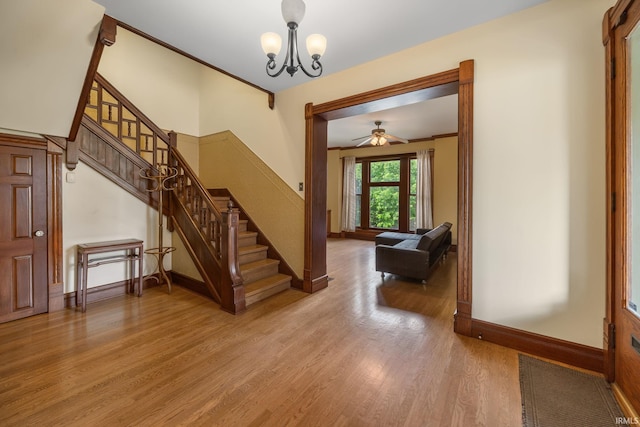 511 N 7th St, Lafayette, IN 47901 - entryway with stairs, wood finished floors, baseboards, a chandelier, and a ceiling fan