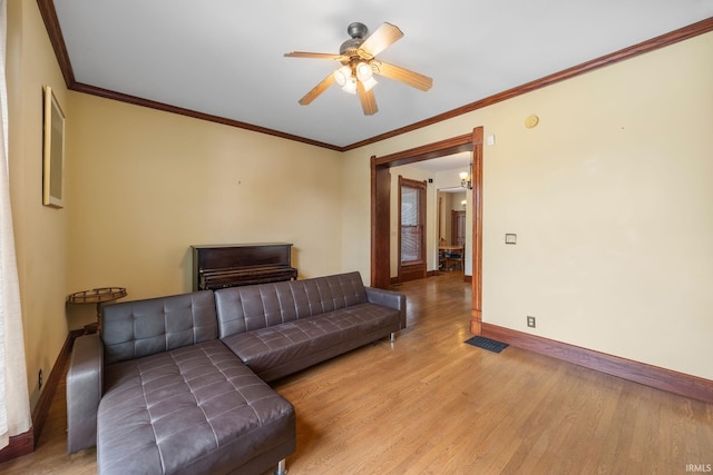 511 N 7th St, Lafayette, IN 47901 - living room with baseboards, light wood-style floors, ceiling fan, and crown molding