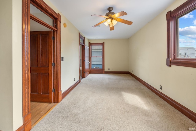 511 N 7th St, Lafayette, IN 47901 - unfurnished bedroom with light colored carpet, baseboards, and a ceiling fan