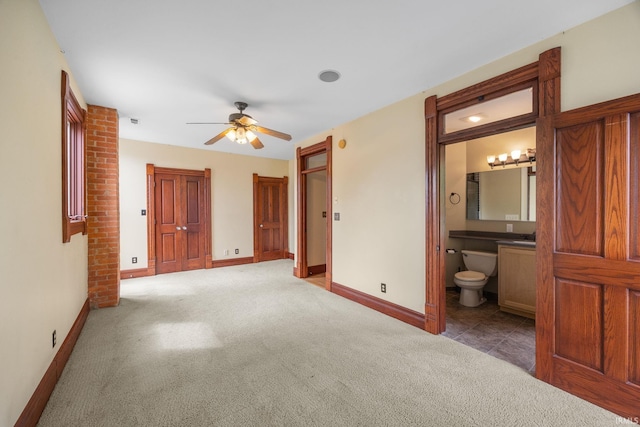 511 N 7th St, Lafayette, IN 47901 - unfurnished bedroom with carpet, baseboards, ensuite bath, and a ceiling fan