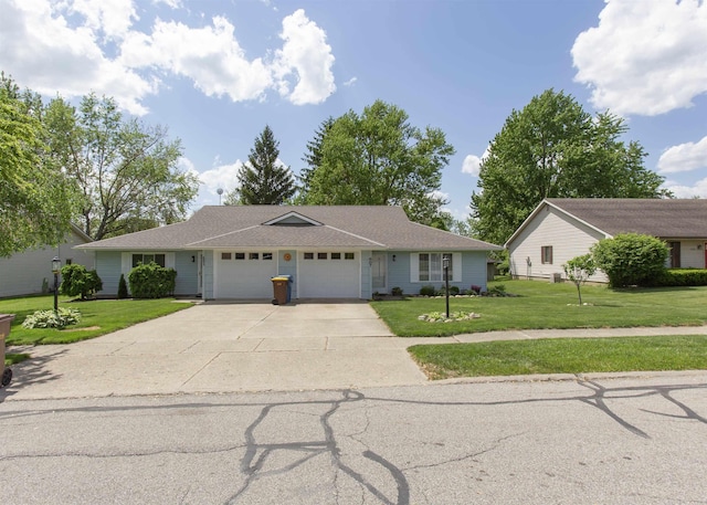 single story home with a garage, concrete driveway, and a front lawn